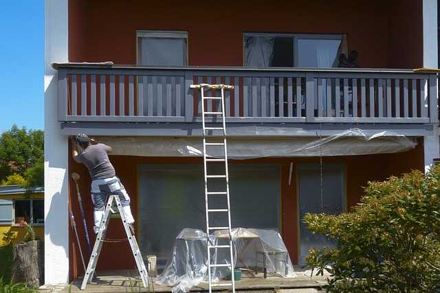 A Painter woking on ladders