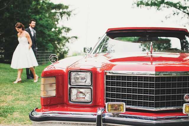 Wedding couple with Red limousine