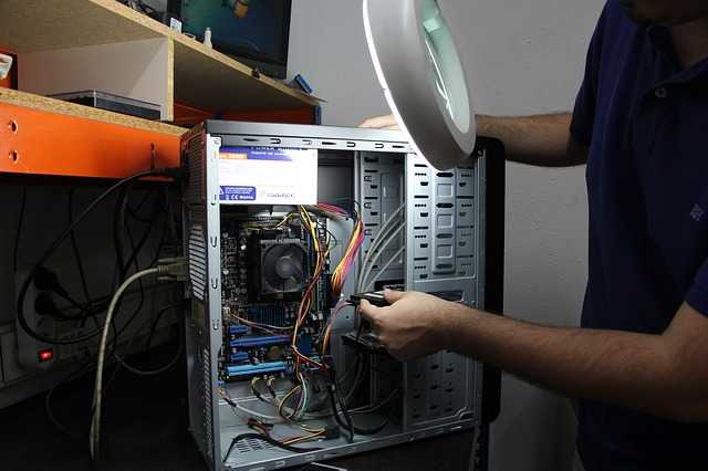 Computer Technician repairing a computer